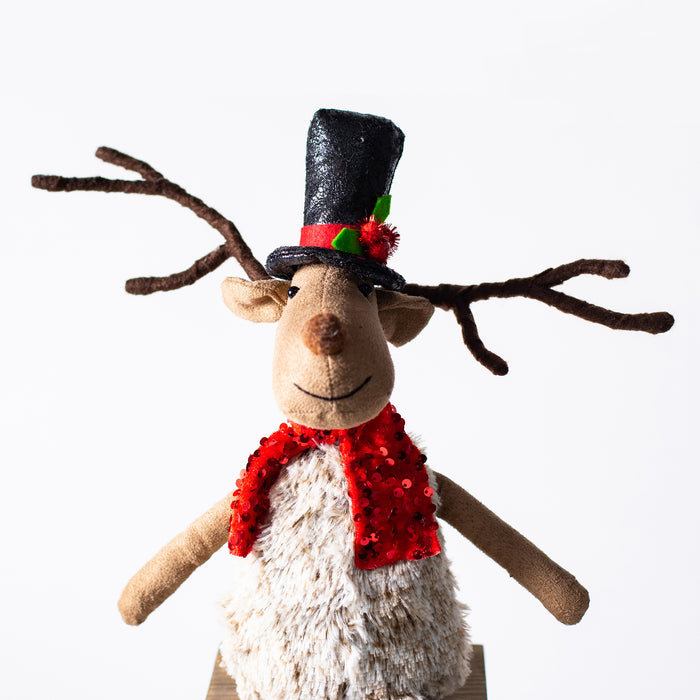 Sitting Reindeer With Red Scarf